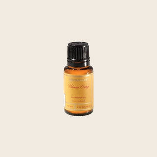 Aromatique Valencia Orange Refresher Oil in amber glass bottle with black cap, 0.5 fl oz