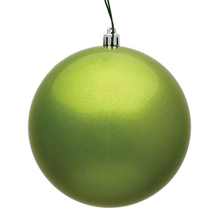 Matte lime green round Christmas ball ornament with silver cap and green hanging cord