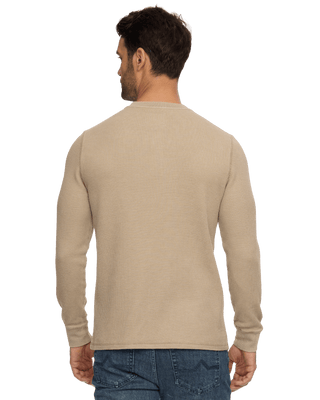Back view of man wearing tan waffle-knit long sleeve henley shirt with jeans