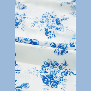 Close-up of Viola polyester fabric texture and medium-blue floral print pattern