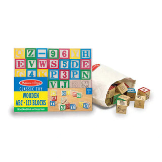Melissa & Doug Wooden ABC 123 Blocks box set with cream fabric storage pouch spilling 50 solid wood alphabet and number blocks
