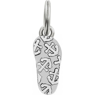 Brighton silver flip flop charm with decorative cross pattern cutouts on white background