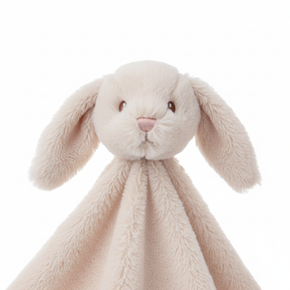 Close-up detail of plush bunny fabric and embroidered face