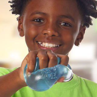 Child holding and stretching blue Nee Doh stress ball fidget toy