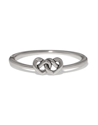 Brighton silver hinged bangle bracelet featuring two interlocked heart motifs in polished silver