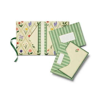 Set of three notebooks with floral and geometric designs 