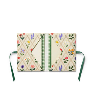 Floral-patterned notebook with a green ribbon