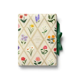 Floral-patterned gift box with a green ribbon
