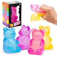 Colorful gummy bear-shaped toys with a hand holding one, and a box in the background.