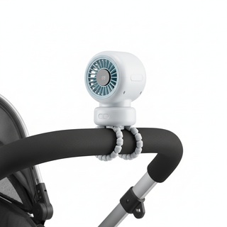 Close-up of stroller fan clipped onto a stroller bar showing the clip attachment mechanism