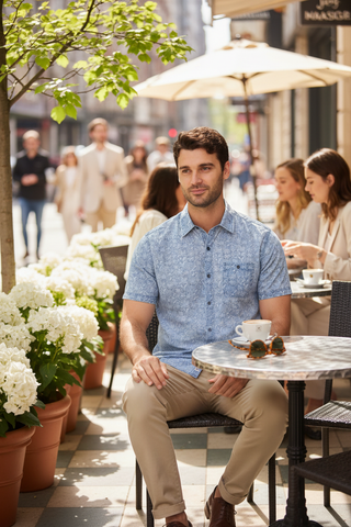 Dorset Floral Vintage Soft Shirt worn by man at outdoor cafe with chinos