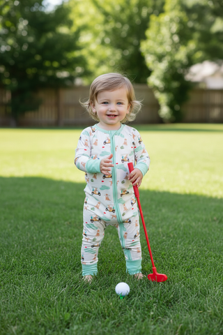 Barks & Birdies Zippie with toy golf club outdoors