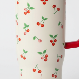 Close-up detail of red cherries pattern on Rifle Paper Cruiser