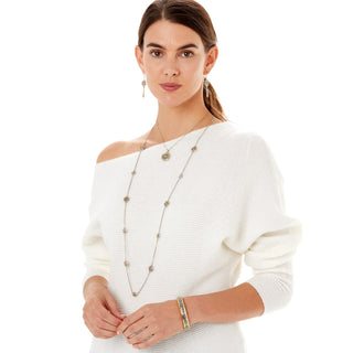 Model wearing Brighton Intrigue Narrow Hinged Bangle in silver and gold two-tone on wrist