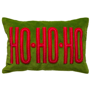 Green velvet lumbar pillow with red tufted HO·HO·HO holiday text