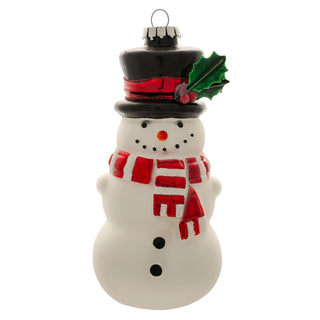 White glass snowman ornament with black top hat, red striped scarf, and holly accent