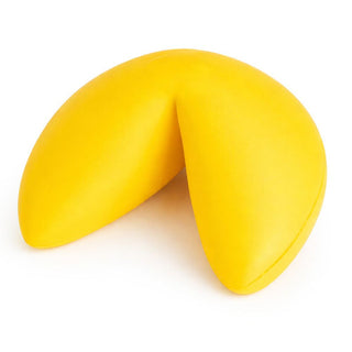 Bright yellow foam fortune cookie shaped stress toy on white background