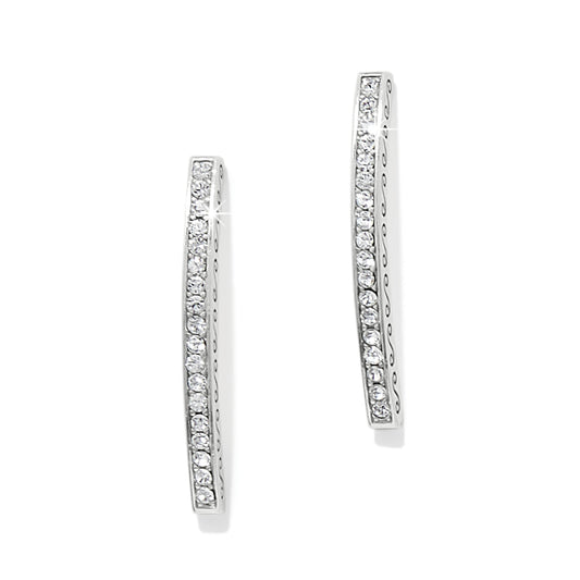 Pair of silver hoop earrings with clear gemstones on a white background