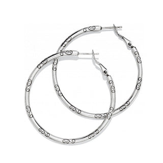 Brighton silver hoop earrings with decorative scroll pattern details on white background