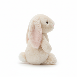Side profile view of plush bunny toy