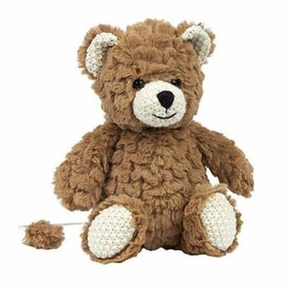 Cocoa the Musical Bear brown plush teddy with shaggy fur and white crocheted accents, tail pulled to play lullaby