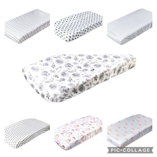 Copper Pearl collection of seven patterned diaper changing pad covers including stripes and prints