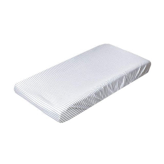 Gray vertical striped diaper changing pad cover fitted on changing table
