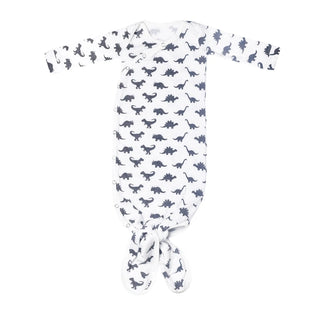 White knotted newborn gown with navy dinosaur print and snap closures