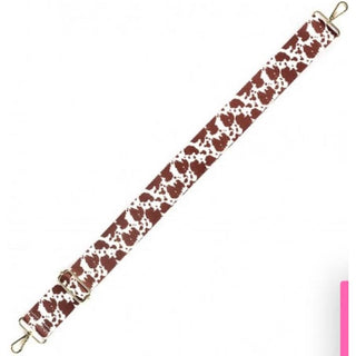 Brown and white cow print adjustable purse strap with gold hardware