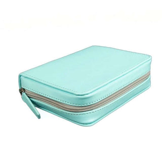Mint green vegan leather tool kit case with rounded corners emphasizing slim travel-friendly profile