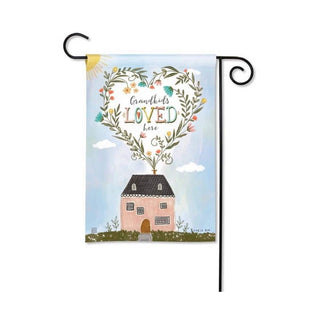 Grandkids Loved Here garden flag with pink house and floral heart wreath on black stand