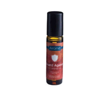 Airomé Guard Against Essential Oil Roll-on in amber glass with rust-orange label