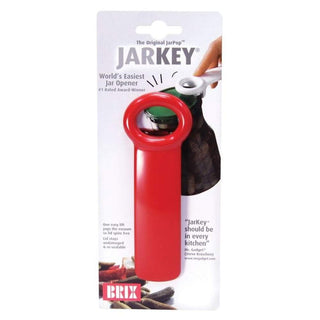 Red matte JarKey jar opener with integrated hook shown against retail packaging demonstrating vacuum seal release on glass jar