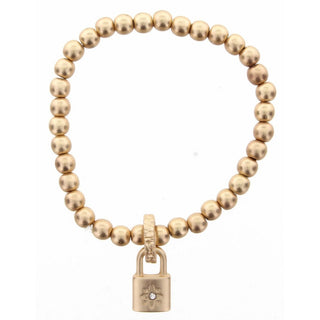 Gold beaded stretch bracelet for kids with floral padlock charm and clear gemstone