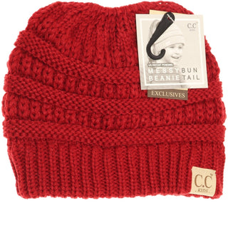 Vibrant red kids knitted beanie with folded cuff and messy bun opening
