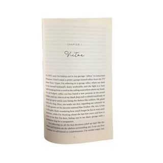 Kinda Like Grace book open to Chapter 1 Victor showing cream paper texture and serif font