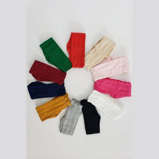 Knee-high kids socks in forest green, red, pink, navy and more with ribbed knit texture for ages 2-6