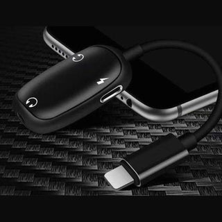 Black matte Lightning adapter resting on iPhone displaying exposed metal contact area
