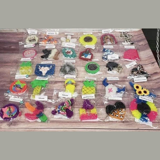 assorted luxury car air fresheners in pineapple, bull skull & heart shapes with glitter, beadwork & leopard print textures