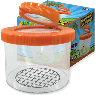 Nature Bound orange magnifying bug viewer jar with flip trap and grid base beside branded gift box