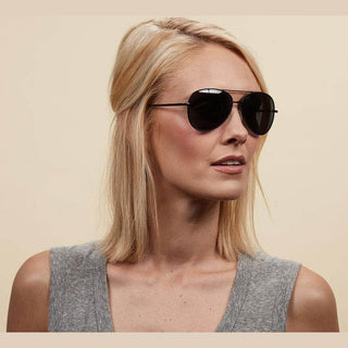 Black aviator sunglasses with double bridge and spring hinges on model
