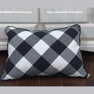 Black white gray plaid pillow with diamond buffalo check pattern and black piping trim
