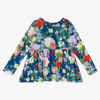 Back view of navy multi-floral long sleeve peplum top for toddlers
