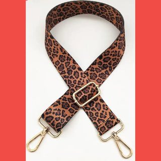 Classic brown leopard guitar bag strap with red borders and gold carabiner hooks