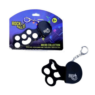 Black silicone micro drum pad with clip keychain in original blue-purple blister packaging for kids