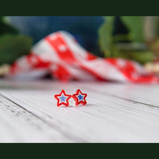 Red white and blue glitter star stud earrings with enamel finish on distressed wood