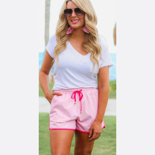 Pink drawstring shorts with fuchsia trim and gold aglets for women
