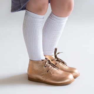 White cable knit knee high socks for toddlers with ribbed cuffs and raised texture